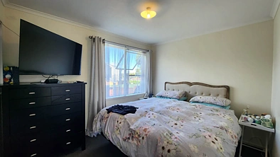 Solid two bedroom unit, in family style block.