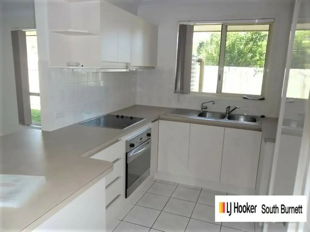 Private 2 bedroom unit with single garage and fenced courtya