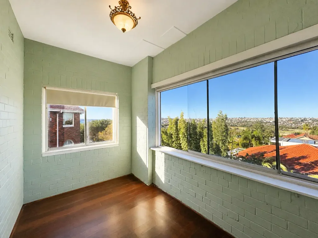 RENOVATED OVERSIZED THREE BEDROOM PLUS SUNROOM