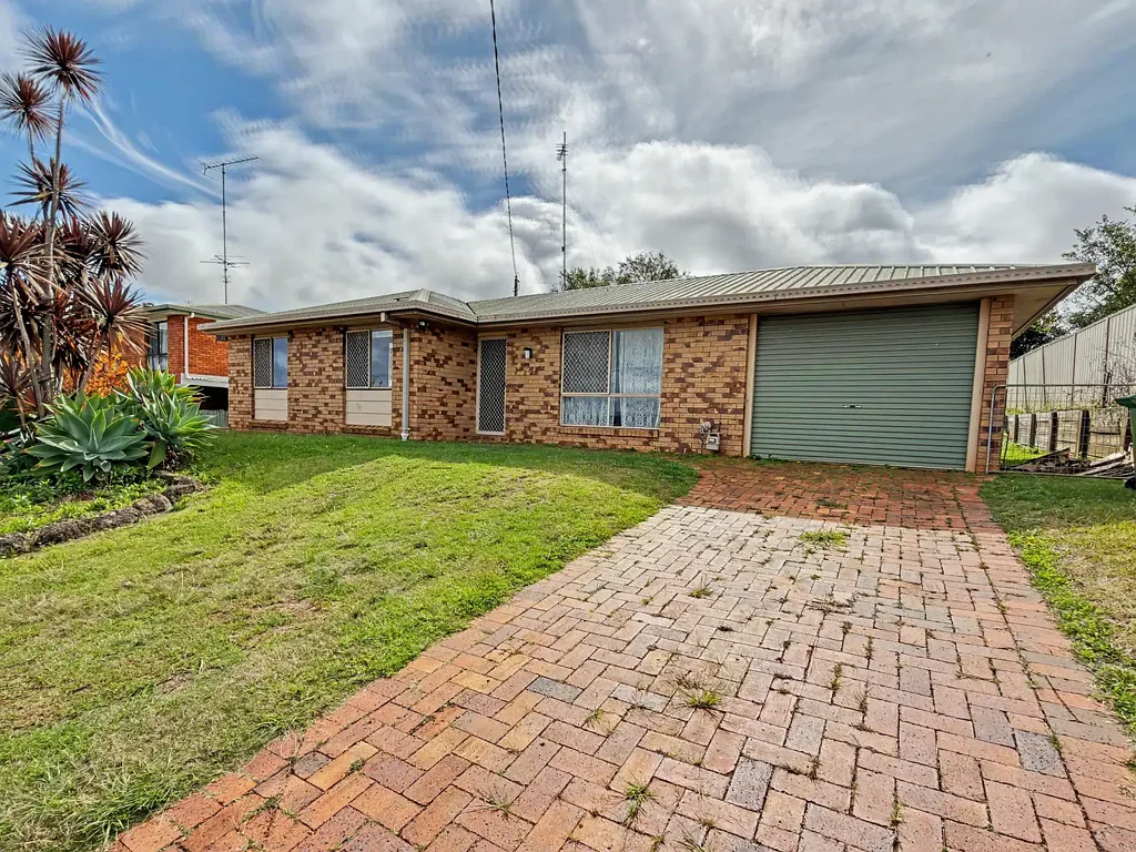 Well-Located Newtown Home with Covered Patio & Fenced Yard
