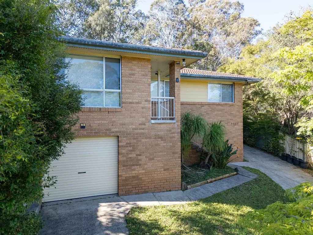 UNDER APPLICATION Easily maintained family home with a large back deck area and yard