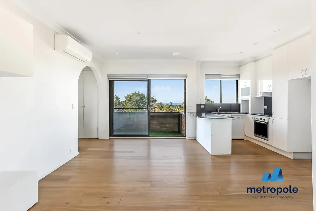 STUNNING TOP FLOOR TWO BEDROOM WITH OCEAN VIEWS AND LOCK UP GARAGE