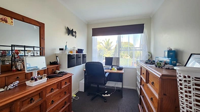 Solid two bedroom unit, in family style block.