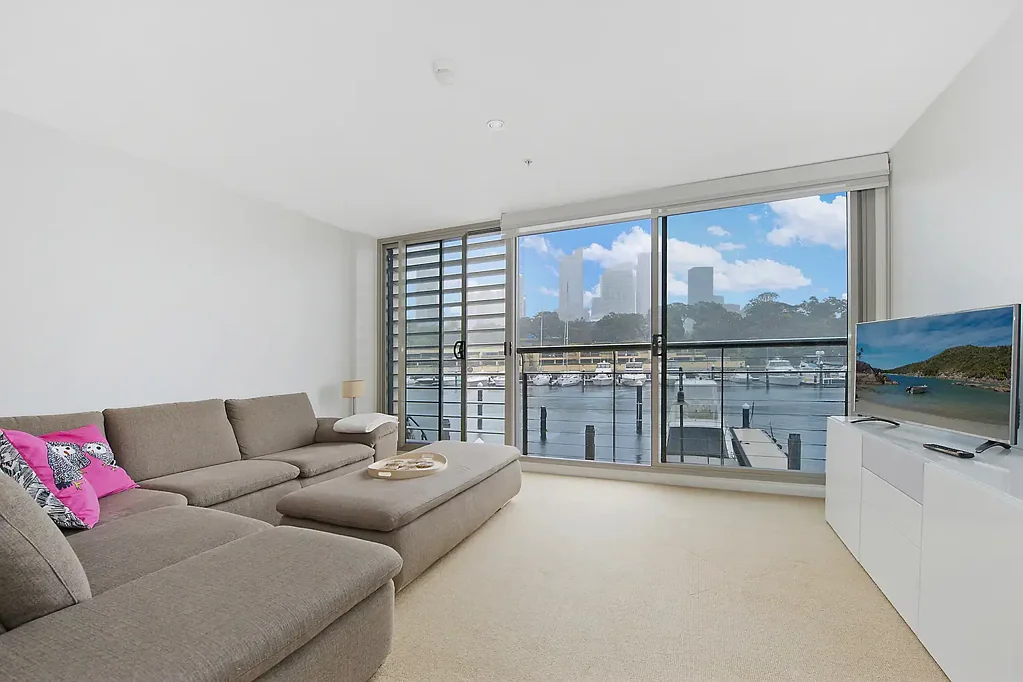 Furnished west-facing apartment with water & city views