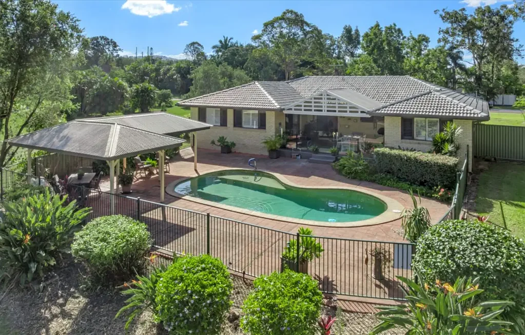 Spacious Acreage Living with Huge Shed & Saltwater Pool - Prime Oxenford Location