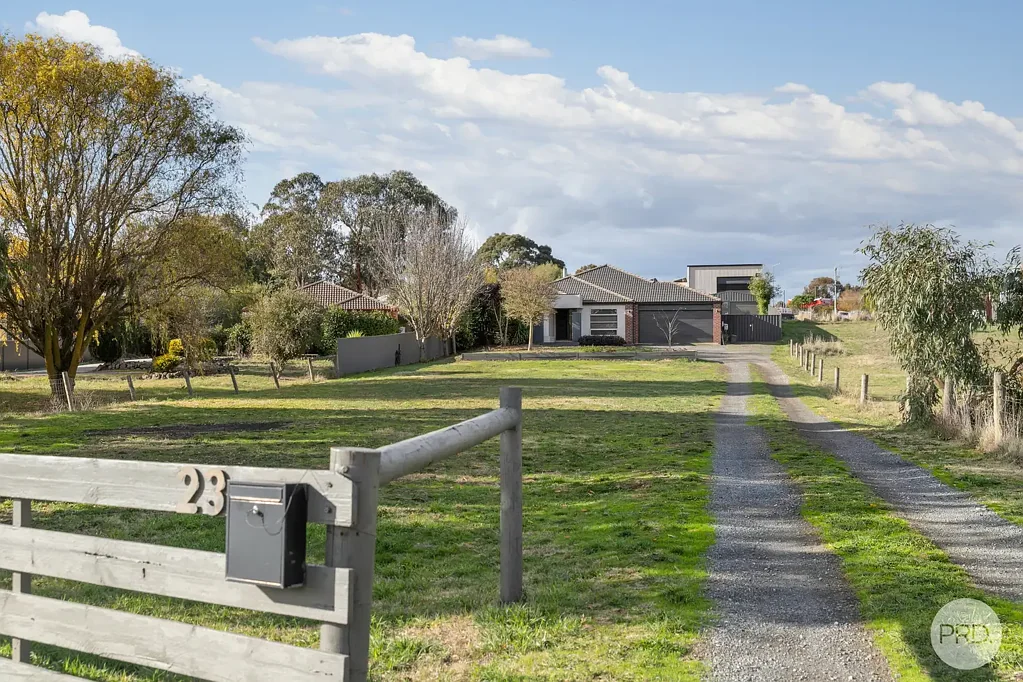 BEAUTIFUL FOUR BEDROOM HOME WITH DOUBLE GARAGE AS WELL AS EXTRA THREE CAR GARAGE AT REAR