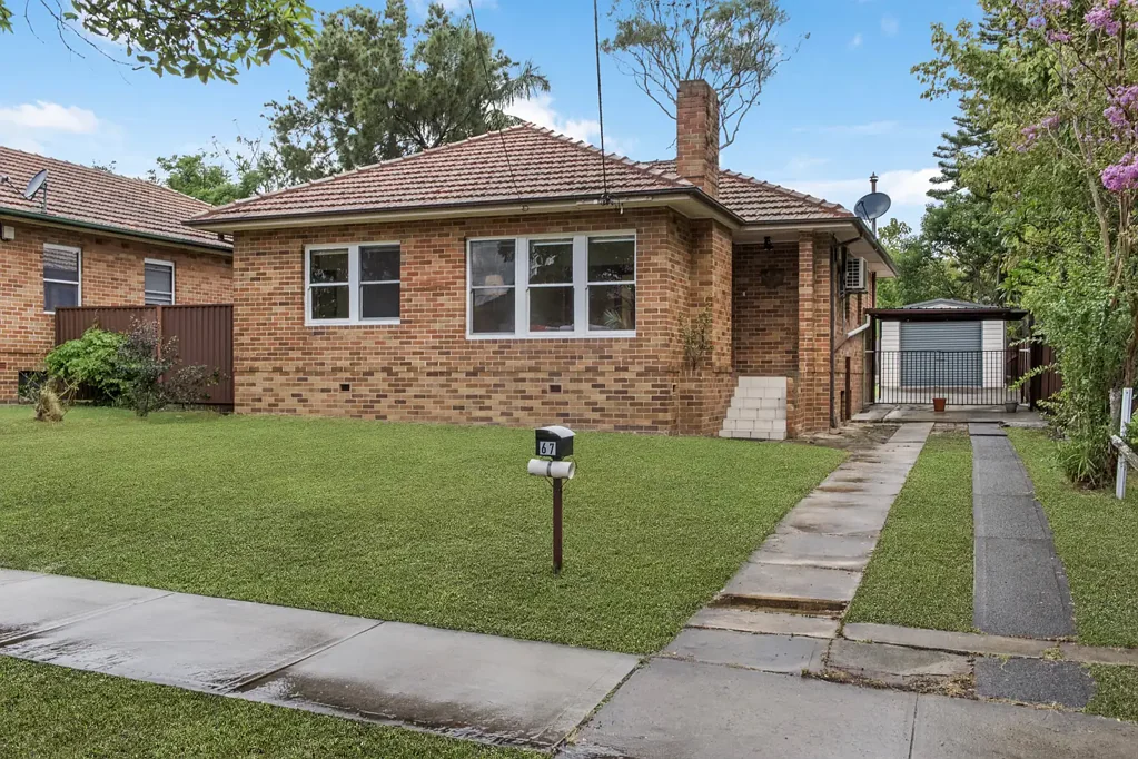 Three-bedroom brick home with backyard and garage