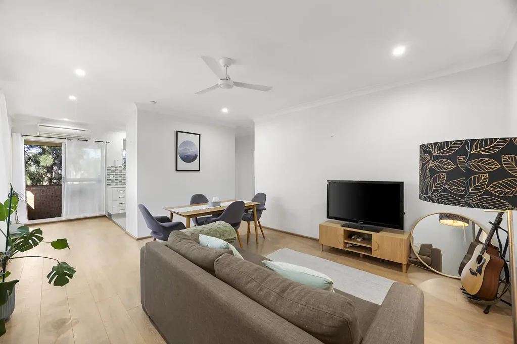 Sunny top floor apartment with North-East facing balcony and secure lock up garage