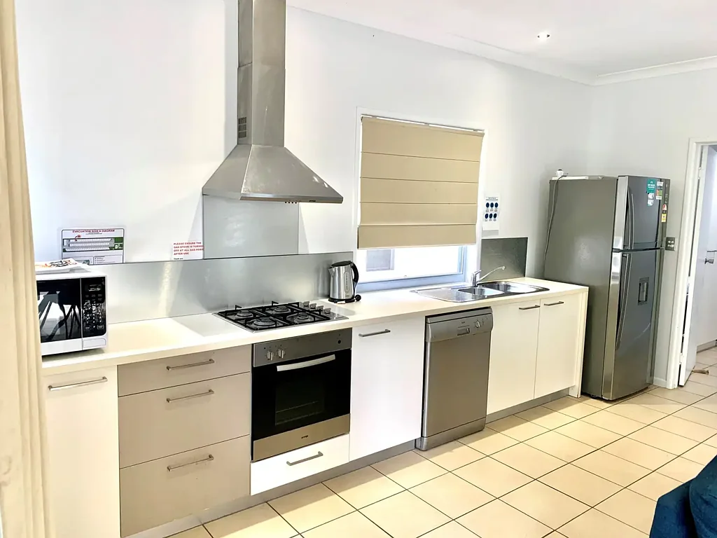 Two bedroom house in resort setting opposite Woodgate Beach