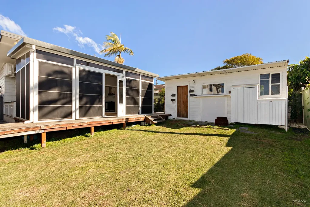 LIGHT-FILLED HOME WITH SUNROOM AND SECURE YARD