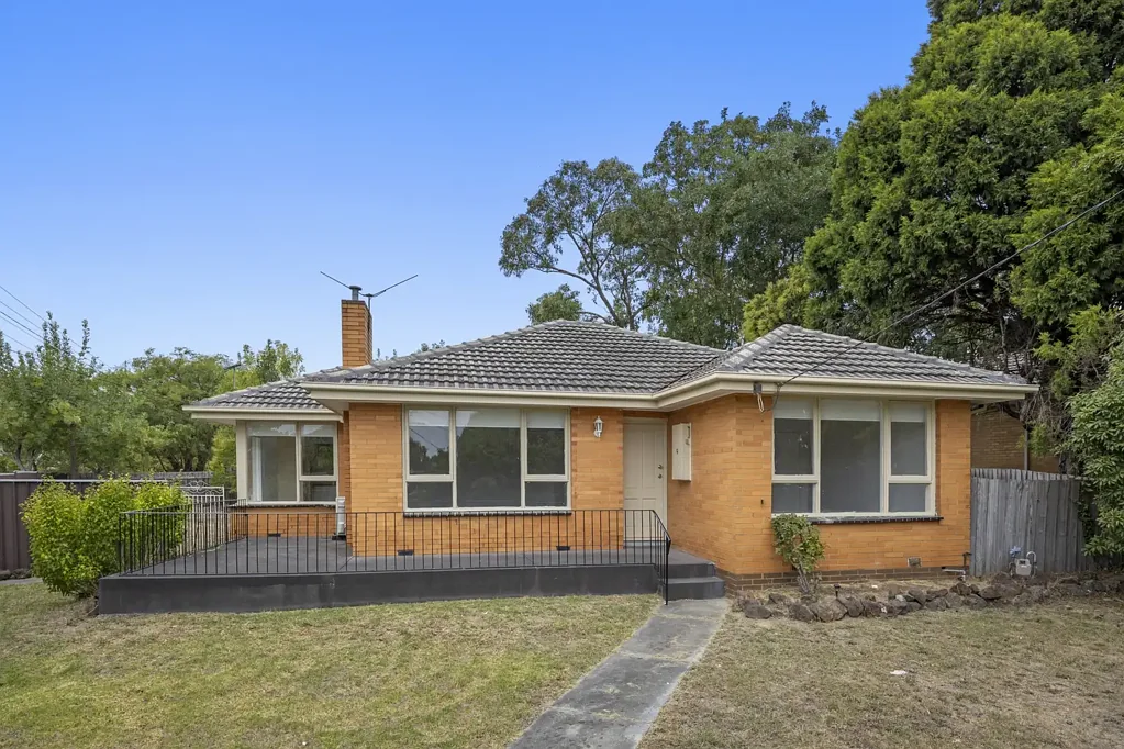 Charming Corner Block Brick Home with Recent Updates