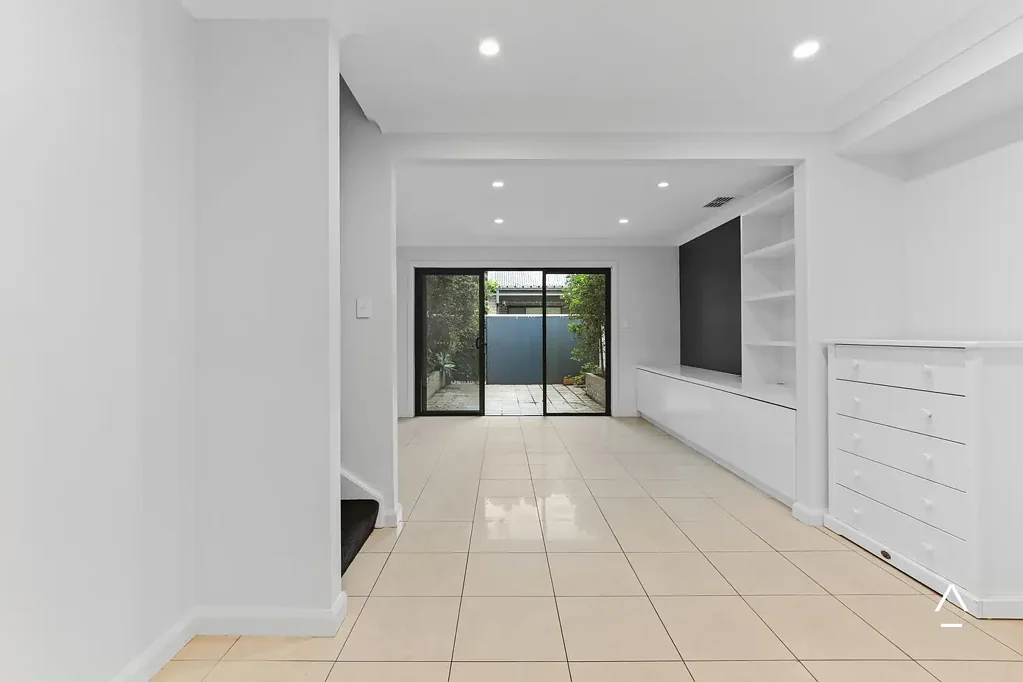 Private, Spacious Townhouse Living with Dual Courtyards & Double Garage in Prime Homebush Location
