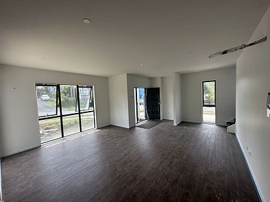 This brand-new house offers four bedrooms, 3 bathrooms, and a single garage.