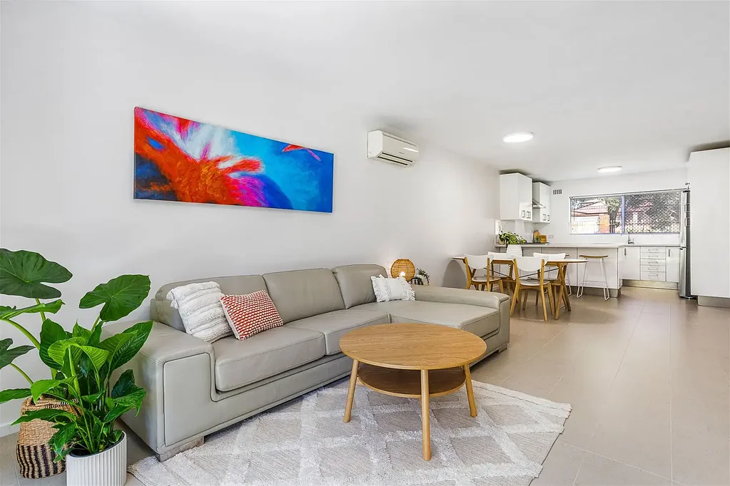FURNISHED large bright ground floor unit in small group