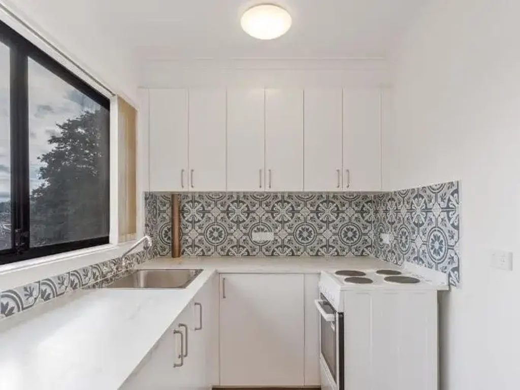 Contemporary Comfort in Sought-After Downer