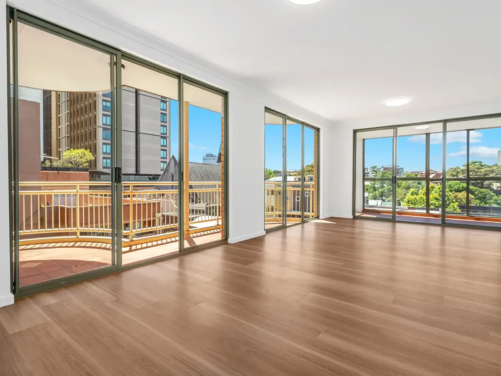 Renovated Top-Floor Apartment with Two Balconies, Enclosed Terrace + Parking