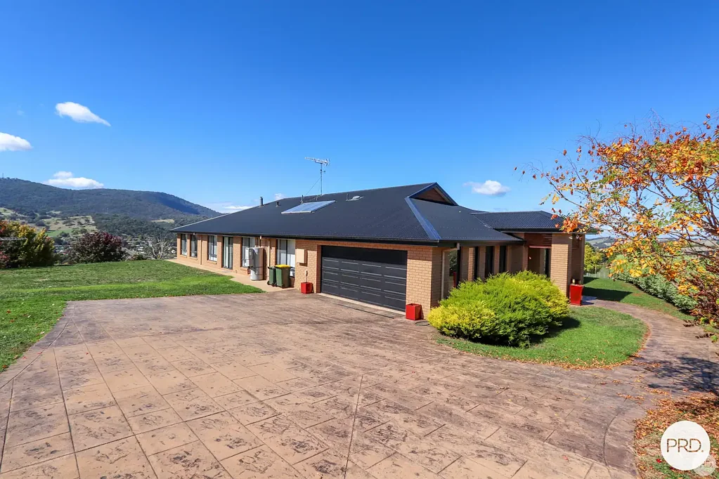 Modern 5BR Home with Stunning Town & Snowy Mountain Views