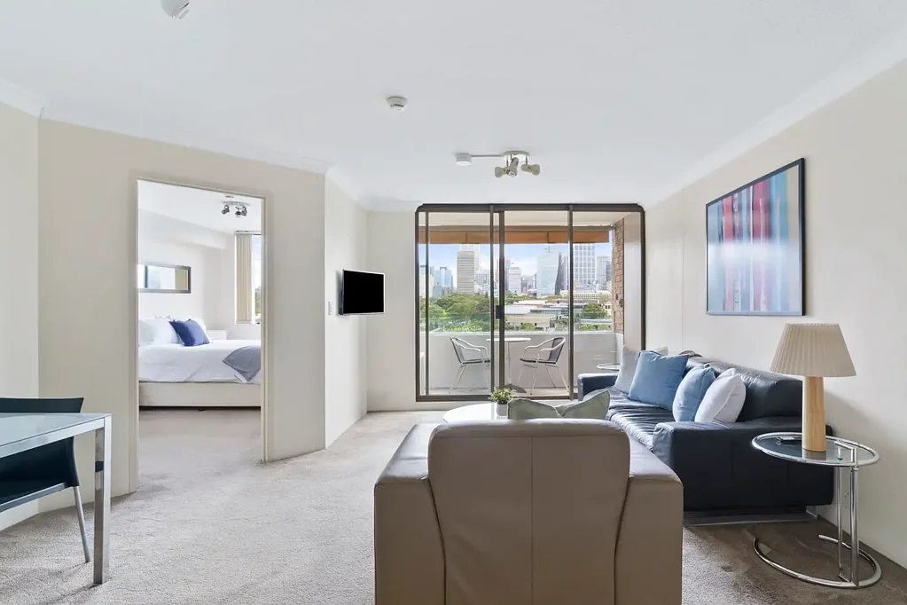 DEPOSIT TAKEN ! SPECTACULAR HARBOUR AND CITY VIEWS FROM THIS LARGE FURNISHED 1 BEDROOM APARTMENT with BALCONY and secure car space