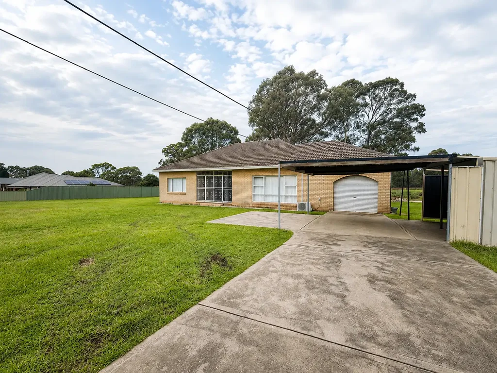 Freshly Updated Acreage Living on 5 Private Acres
