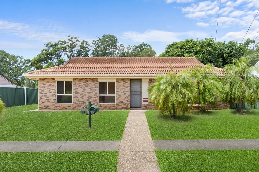 Low-set family home with large powered shed