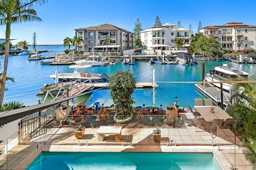 Runaway Bay 3 Bedroom Direct Ocean Access Waterfront Home of Enduring Coastal Comfort with 45ft Deep Water Pontoon.