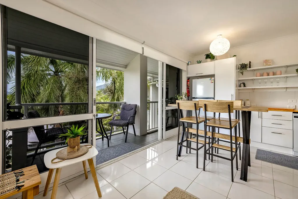 Peaceful top-floor living moments from Palm Cove esplanade