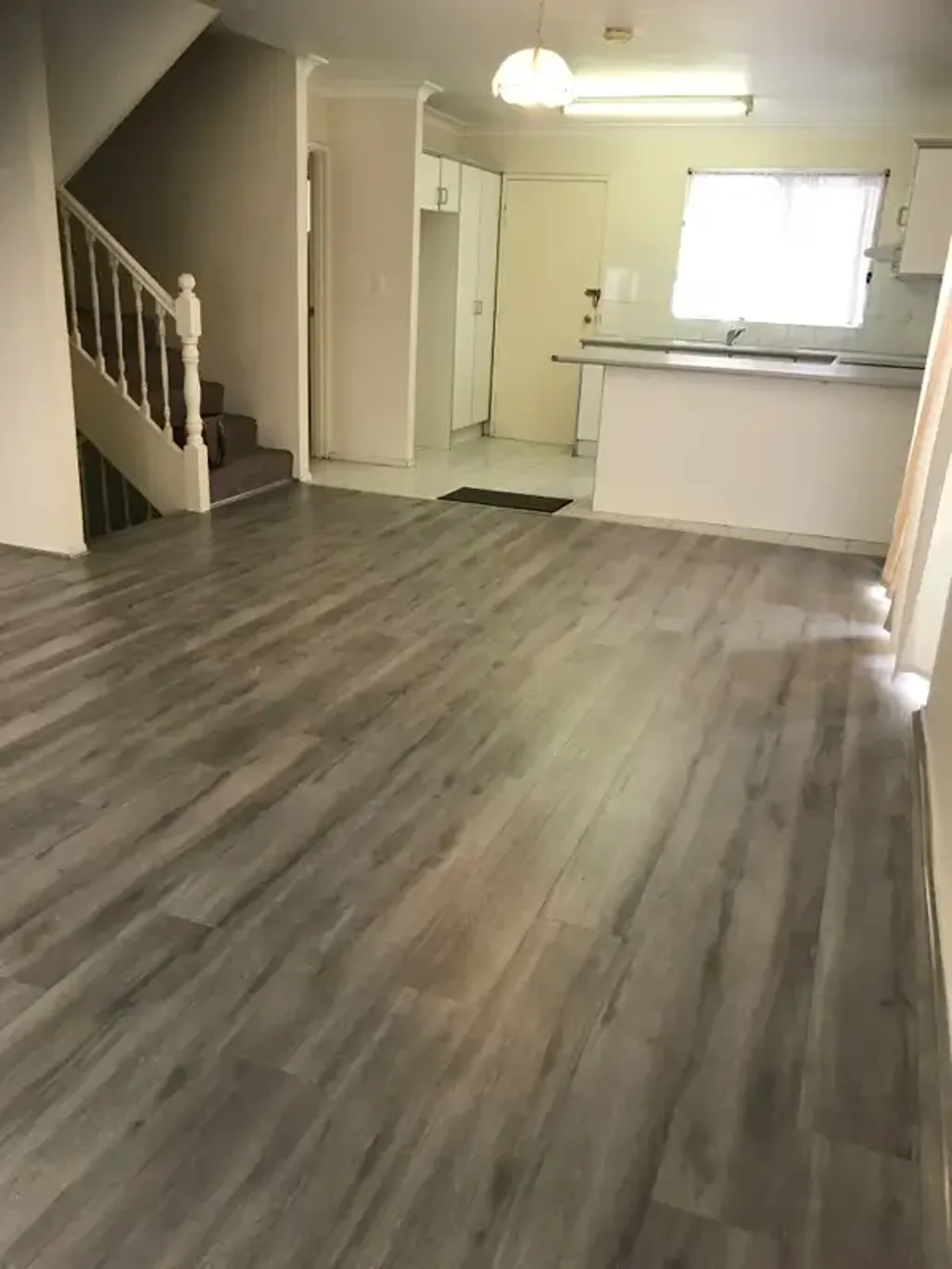 Handy Location - New Timber laminated flooring in lounge