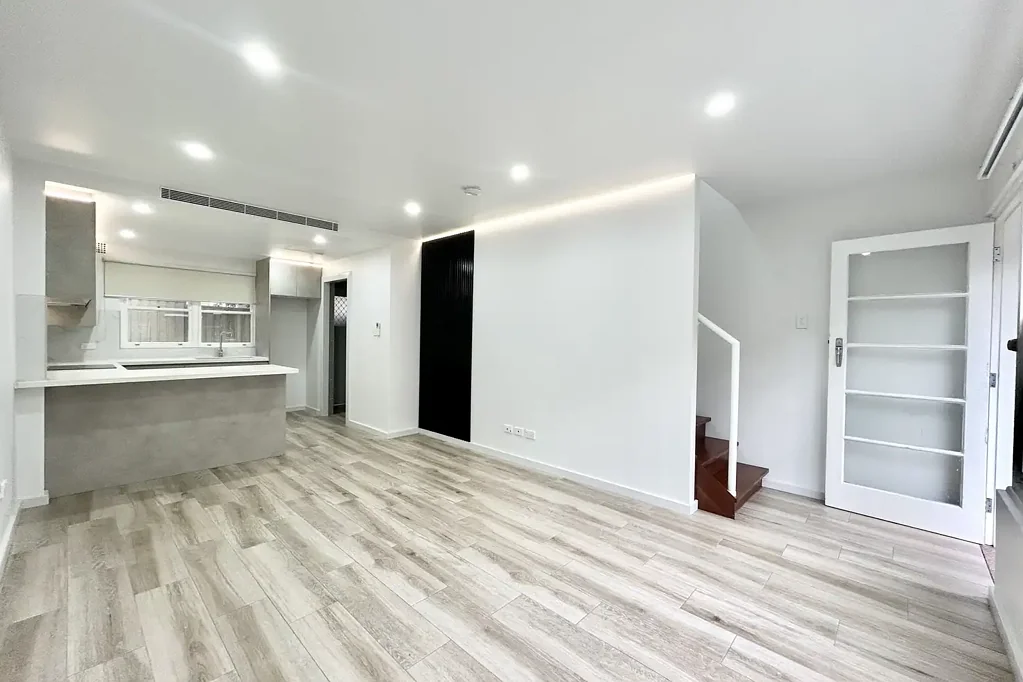Modern Split-Level Townhouse-Style Apartment with Private Courtyard