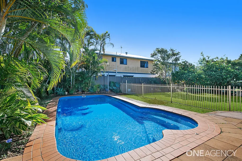 Queenslander with inground pool, garage & storage rooms!