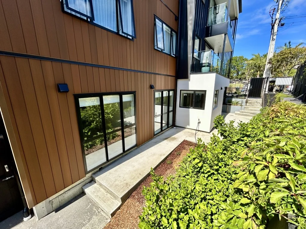 The one! Downstairs corner apartment with large patio and separate entrance