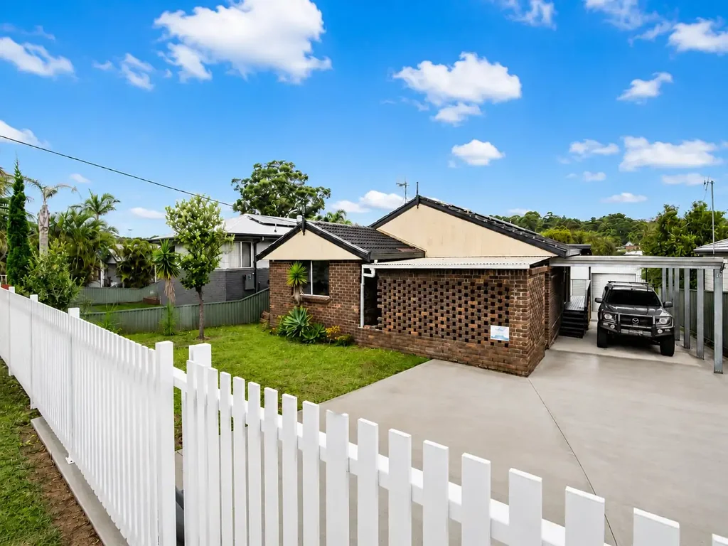 Spacious Three-Bedroom Home with Covered Front Verandah, Rear Entertaining Deck & Tall Tandem Carport