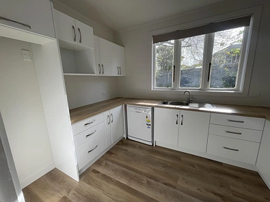 Sunny Renovated Home with no Lawns to Mow!