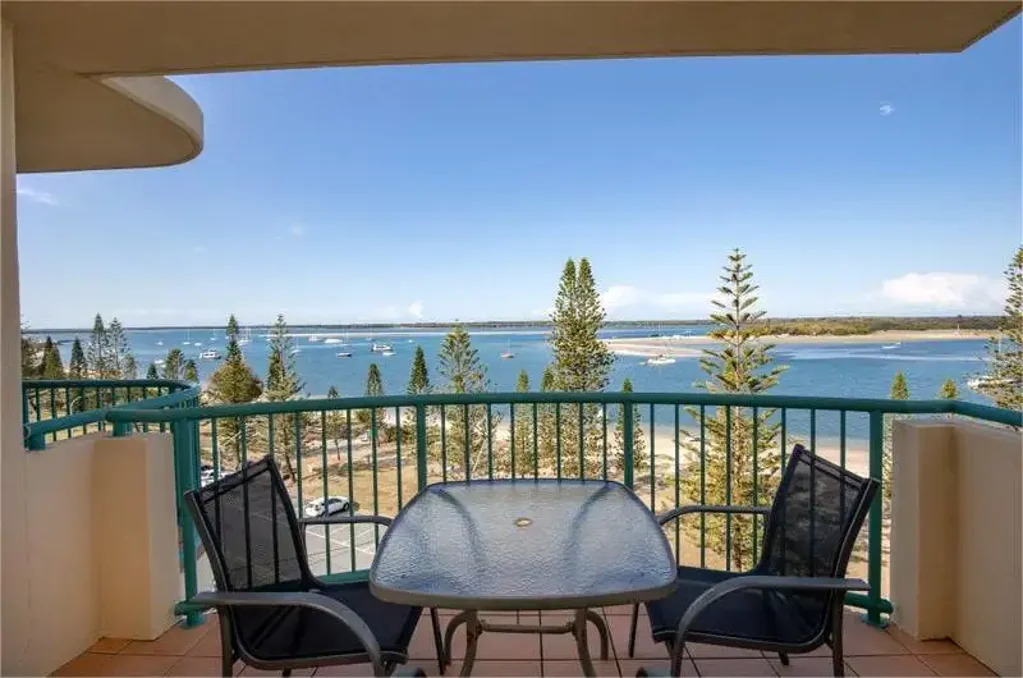 Elevated Coastal Living: Top Floor Retreat in Biggera Waters