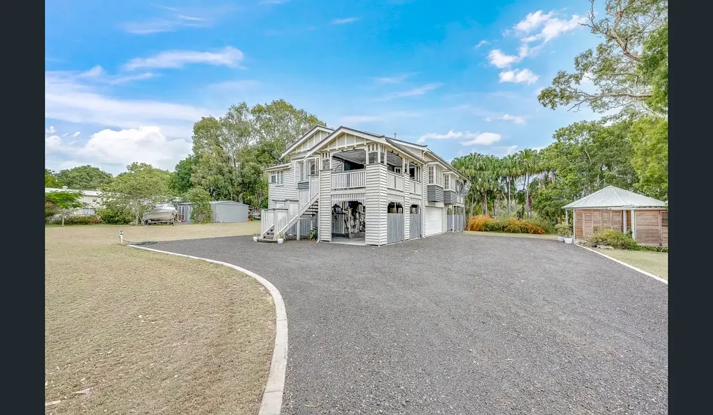 Timeless Queenslander Elegance on 4,100sqm Backing Onto Lagoon