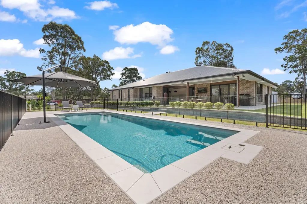 Sunshine Acres 4Zimmer A RARE ACREAGE OFFERING – NEAR-NEW LUXURY, POOL, SHED AND SPACE FOR EVERY GENERATION