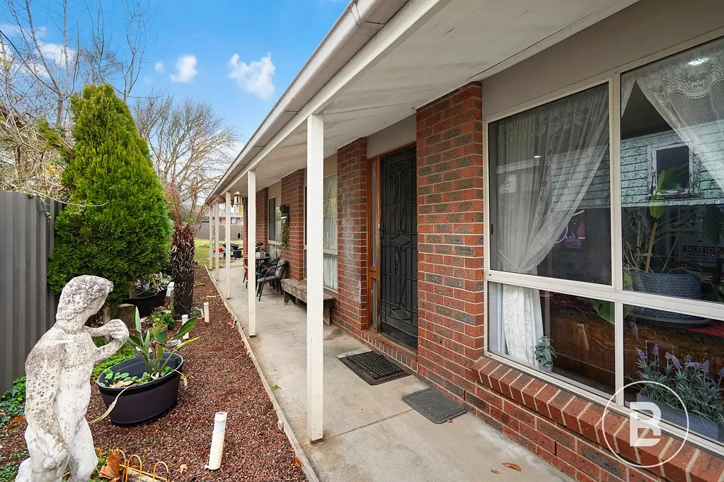 PRACTICAL THREE-BEDROOM BRICK HOME WITH REAR ACCESS