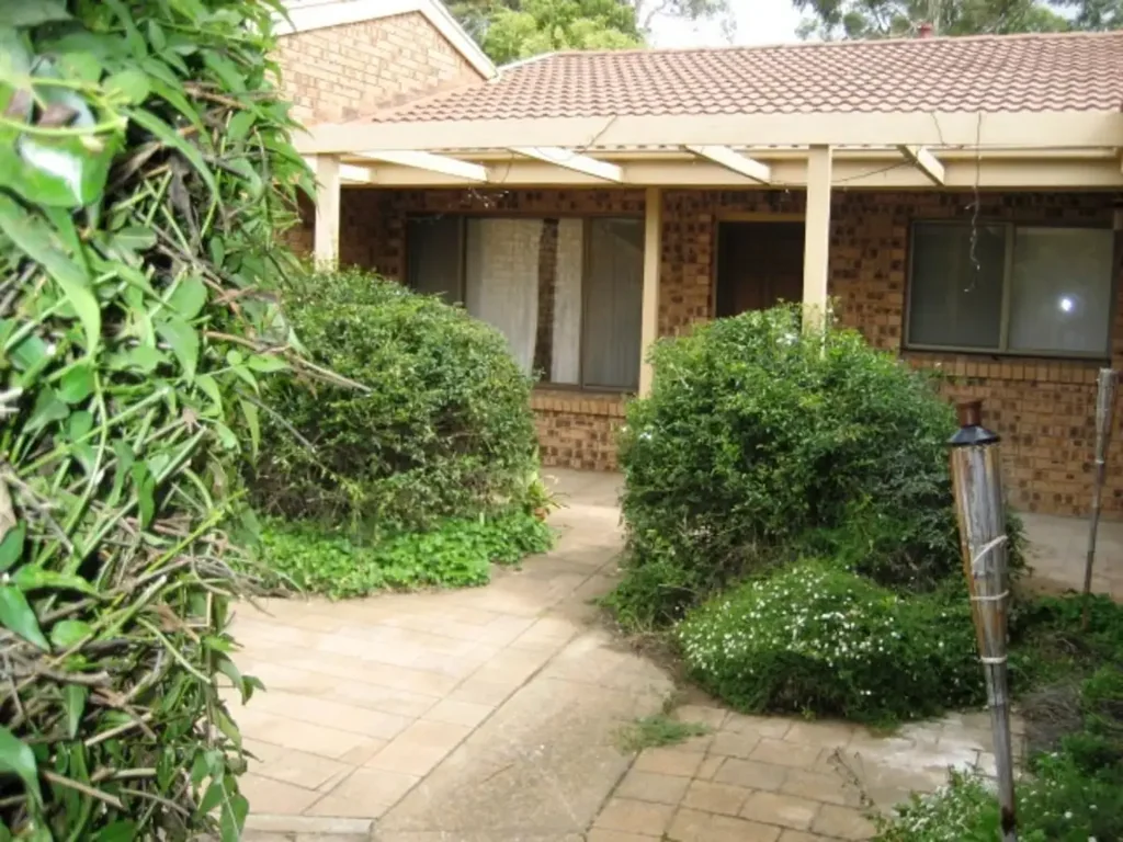 Quaint two bedroom townhouse with courtyard and garage