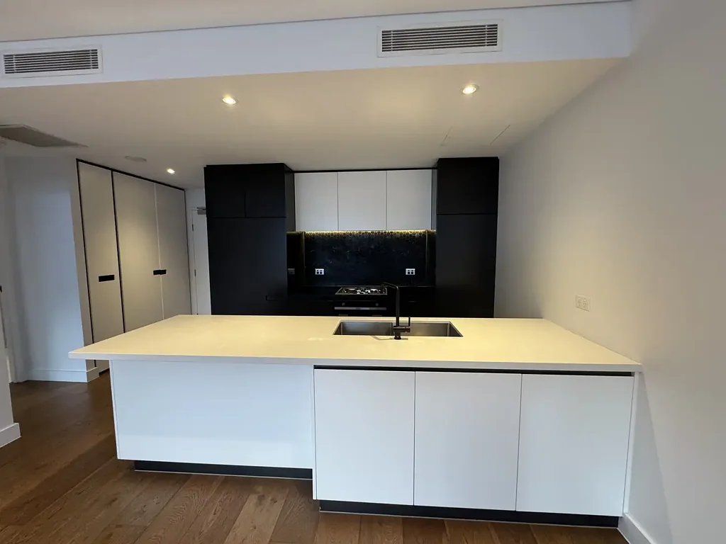 Modern 1-bedroom, Bathroom, open plan living with floorboards, Ducted AC & large private covered balcony.
