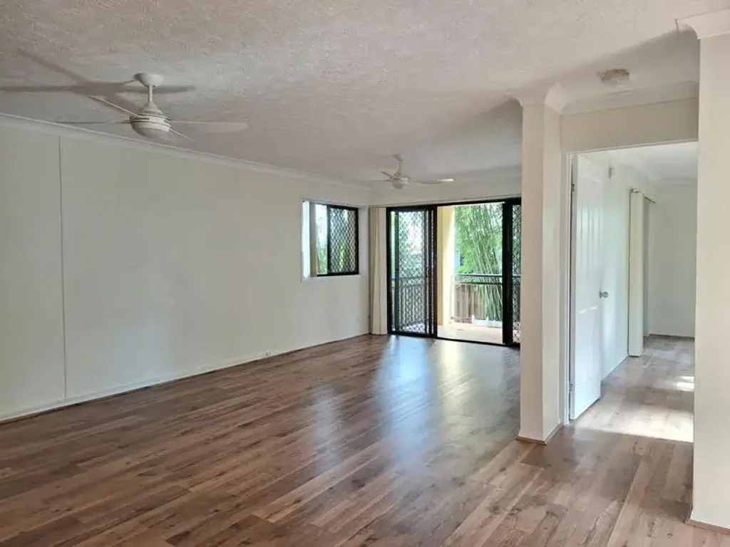 RECENTLY UPDATED TIMBER-LOOK FLOORING & FRESH PAINT, THE UNIT RADIATES STYLE AND SOPHISTICATION
