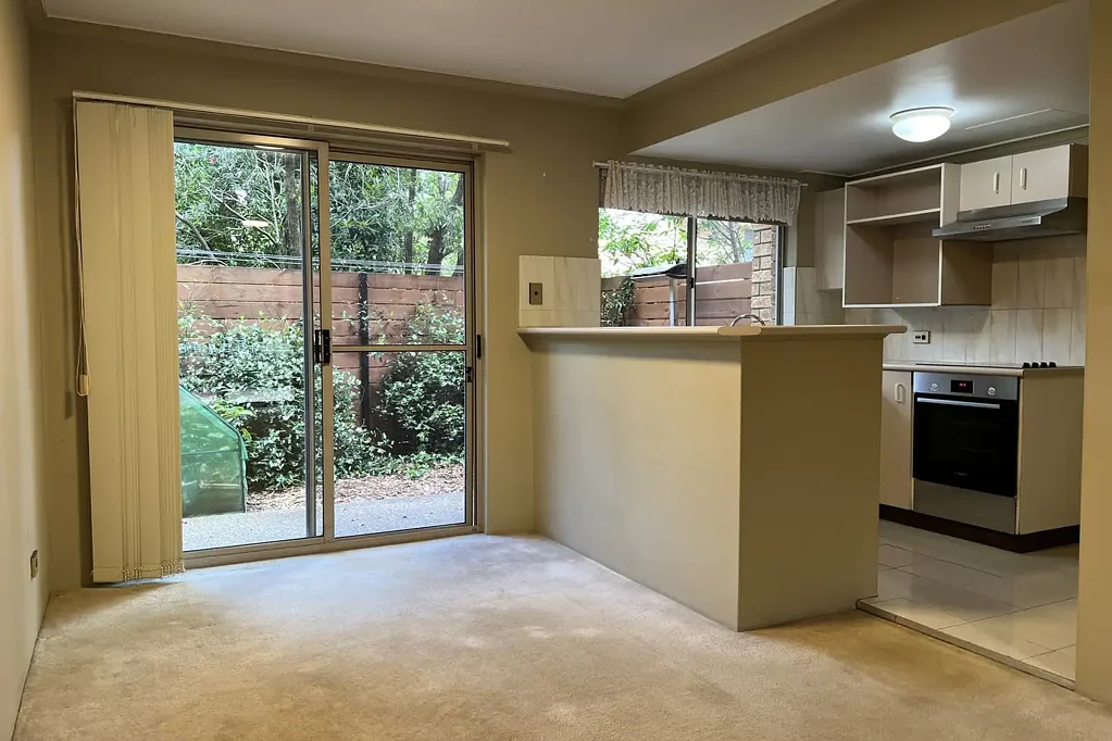 Spacious 2 bedroom townhouse in leafy setting with lock up garage, indoor heated pool and spa