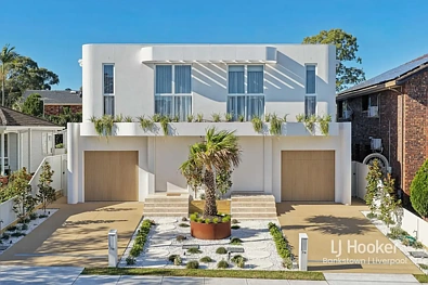 Milperra 5房 弧形建筑特色、双砖结构和奢华装修 Curved Architectural Features, Double Brick Construction and Luxury Finishes Thr