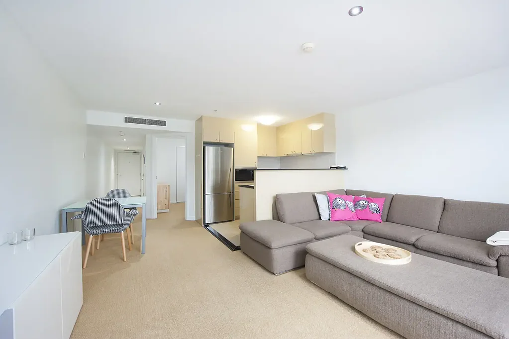 Furnished west-facing apartment with water & city views