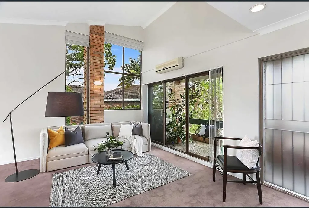 Top-floor two bedroom apartment with city & harbour views, soaring ceilings, huge balcony and lock-up garage