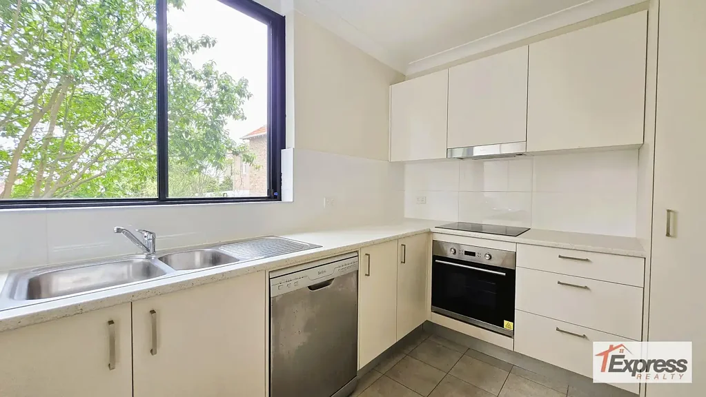 MODERN TWO BEDROOM UNIT WITH NEW CARPET, NEW PAINT, BALCONY, POOL AND PARKING
