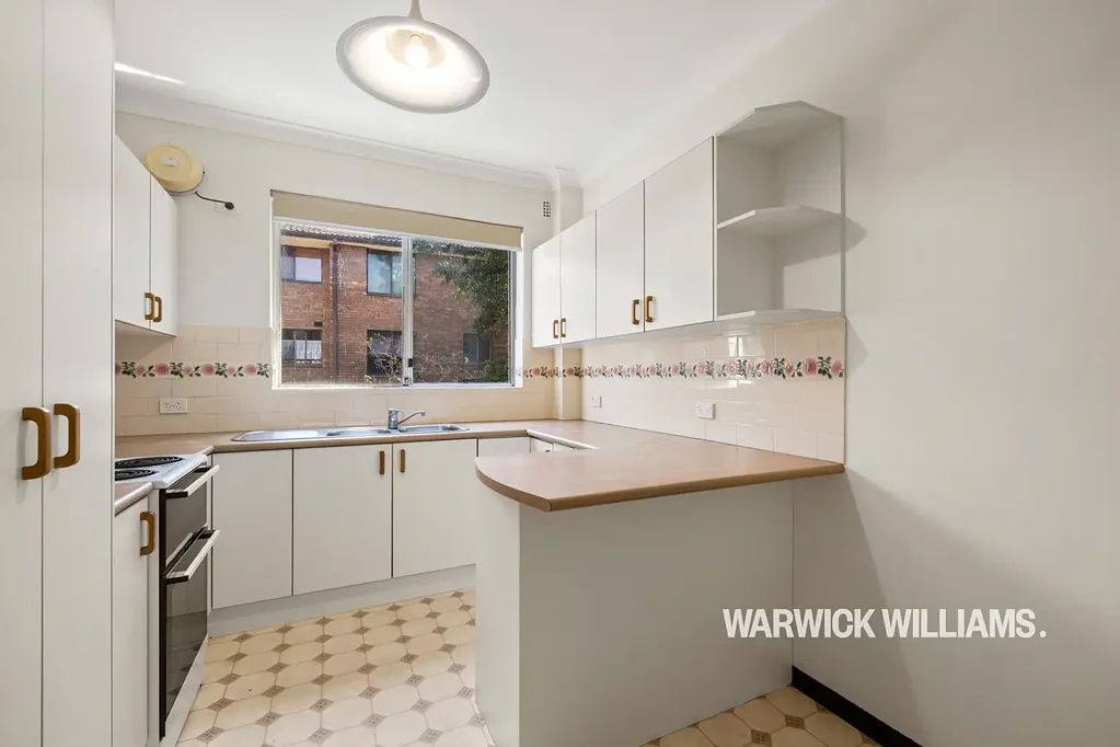 SPACIOUS TWO-BEDROOM UNIT WITH BALCONY AND LOCK-UP GARAGE