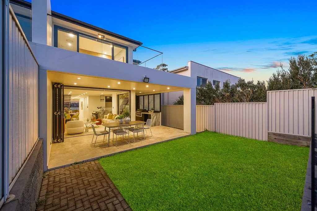 Style, light & quality in stunning dual-level residence with water views in Premier Location