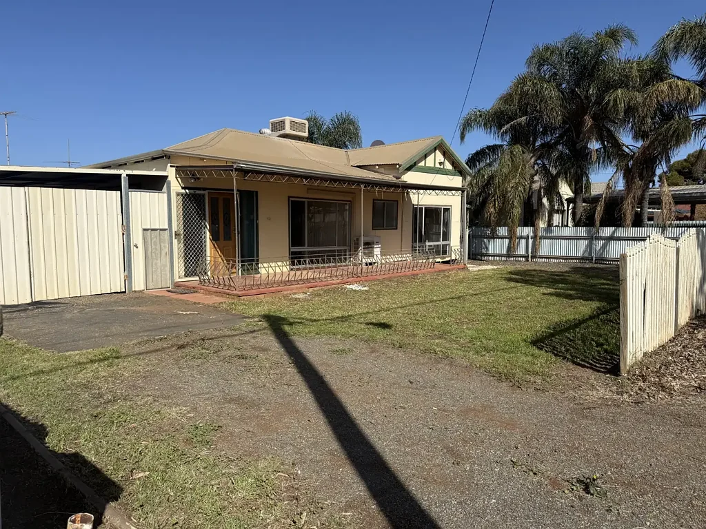 Spacious 3 Bedroom House with large yard and rear lane access.