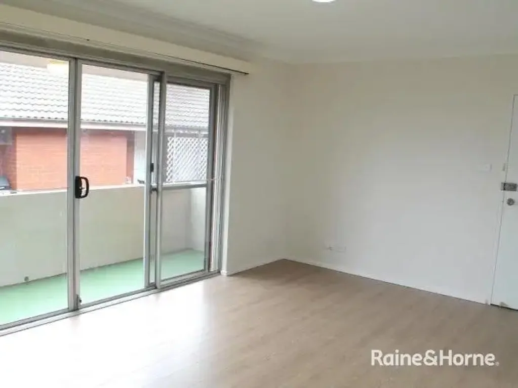 BEAUTFUL TWO BEDROOM UNIT WITH TWO SUNNY BALCONIES AND GARAGE!