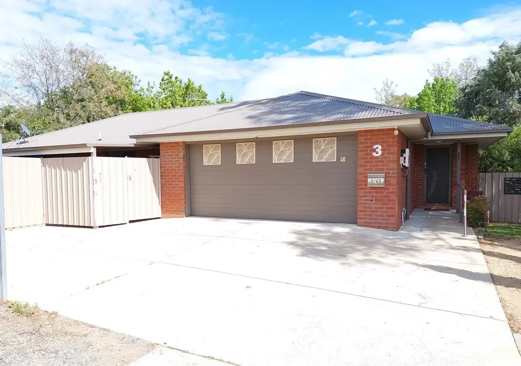 MODERN EXECUTIVE THREE BEDROOM BRICK HOME