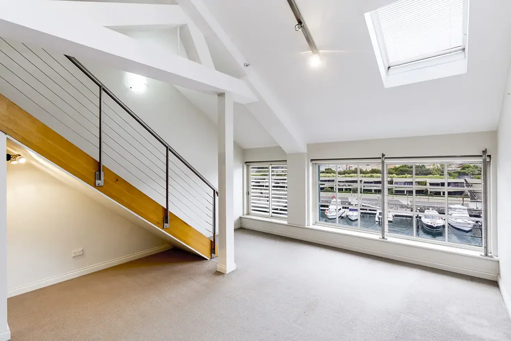 Large unfurnished loft style apartment with city views
